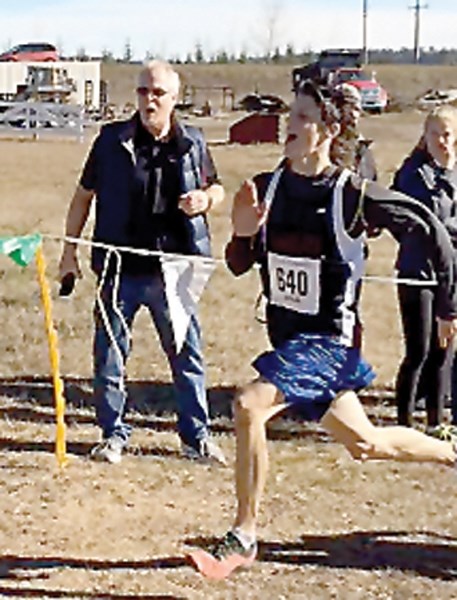 R.F. Staples’ Nathanael Tabert sprints to finish at the ASAA provincial cross country race in Cochrane Oct. 15. Tabert was the best local finisher, placing 23rd out of 103