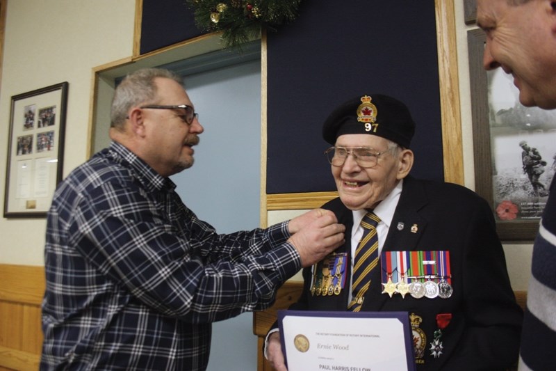 Westlock mayor Ralph Leriger (left) and Westlock Rotary Club past president Randy Wold (right) flank Ernie Wood, who received a Rotary Paul Harris Fellow award at the Legion