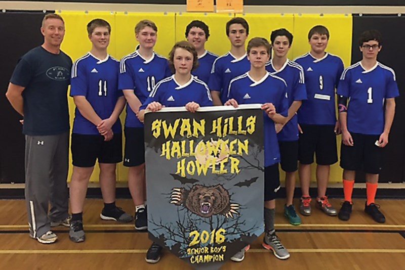 The St. Mary Sharks with the championship Swan Hills Halloween Howler Tournament banner. Back row L-R: coach Vance Nakonechny, Raegan Moon, Jared Boss, Wyatt Granger, Dominic 