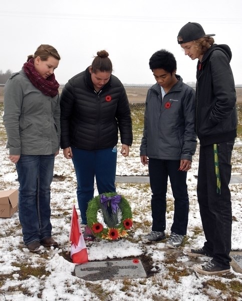 Grade 11 St. Mary School students held a No Stone Left Alone service, laying poppies on the graves of veterans at the St. Mary Cemetery Nov. 2 to mark Remembrance Day. L-R: