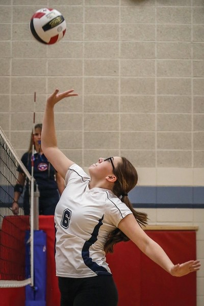St. Mary Sharks Morgan Calladine sends the ball over the net at a Nov. 5 tournament in Boyle. The club’s season ended Nov. 8 following a confer-ence game loss to Thorhild.