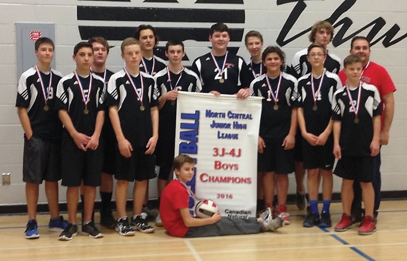 The R.F. Staples junior high boys volleyball team with the North Central Junior High Athletic Association (NCJHAA) Zone 4J Volleyball Champi-onship banner they claimed Nov.
