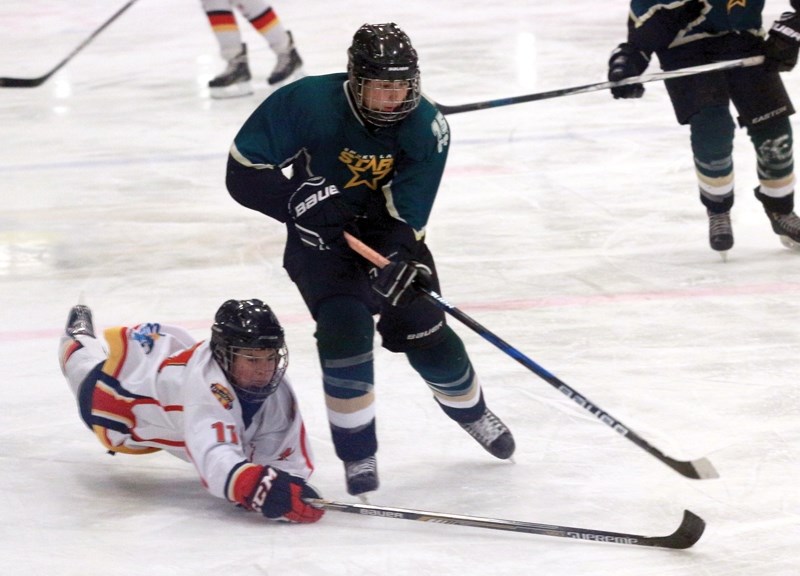 Midget Warrior Ben Carlson dives for the puck during a 7-5 Dec. 16 loss to the Smoky Lake Northstars at the Rotary Spirit Centre.