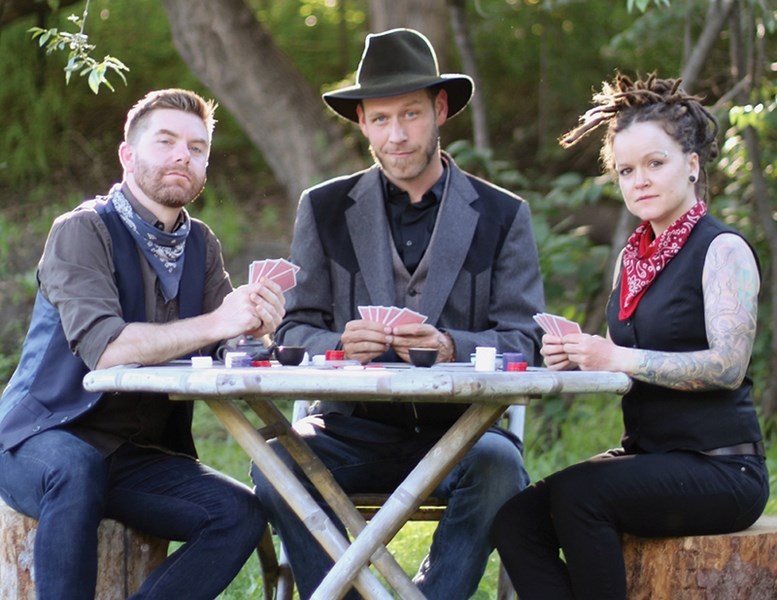 Scott Cook plays some cards with his bandmates Bramwell Park and Melissa Walker of the Second Chances. The trio plays the Cultural Arts Thea-tre Jan. 6.