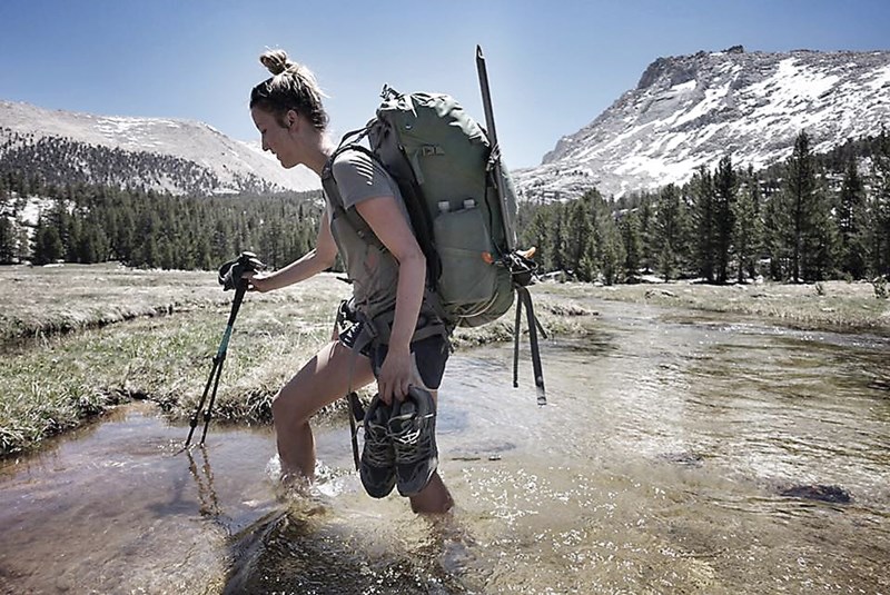 Julie Bourque crosses one of the many cold streams encountered on her 149 day Pacific Crest Trail hike from the Mexico/U.S. border to the Cana-da/U.S. border. The Westlock