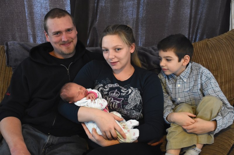 Proud parents Cody Bogacki and Krystin Barnett welcome baby Elissa Marie Rene Bogacki as big brother Ethan, 8, looks on (missing is big sister Elexus, 3). Elissa was born at