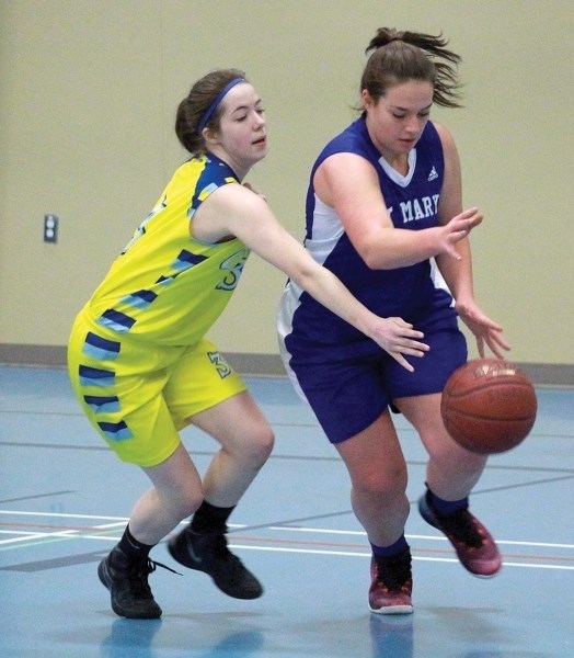 St. Mary Sharks’ Eme Artemenko races for the ball during their game versus the Breton Cougars at the Peter Molesky Classic on Jan. 13.