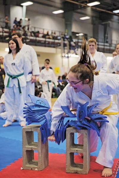 Sidney Platt blasts through a series of boards like they were twigs at the Whitecourt Taekwondo Tournament Jan. 28.