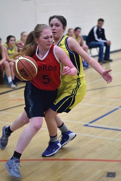 R.F. Staples&#8217; Delaiya Dutchak flies past a defender during the divisional finals Feb. 23 in Barrhead.