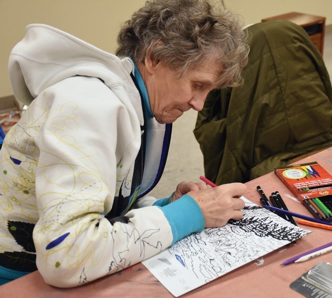 The Westlock Community Art Club is asking schools, groups, service clubs and officer staff to participate in the Canada 150 Mural Mosaic. Justine Friesen colours in a scene