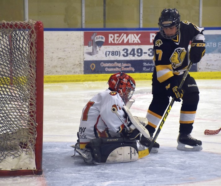 Warriors’ goalie Cooper Buchko blocks a shot from a Strathcona Warrior March 16 at the Rotary Spirit Centre. The Westlock Warriors posted a 3-2 victory in Game 1 of the