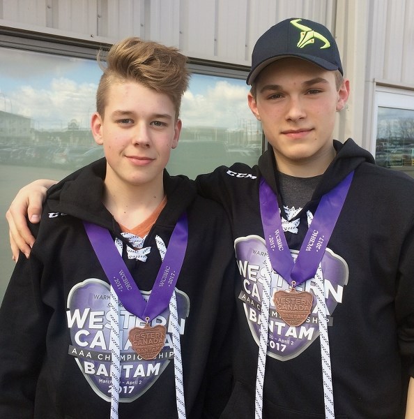 Ashton McNelly (left) and Cache Schiller don their bronze metals following the Fort Saskatchewan