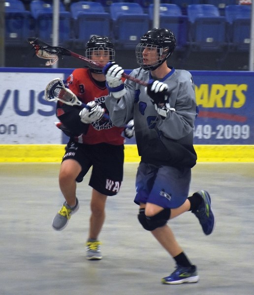 Westlock Rock Bryce Chapotelle keeps an eye on the ball and out of reach of an Edmonton Warrior during the club’s 13-4 May 16 home win. The victory gives the Rock a 5-0