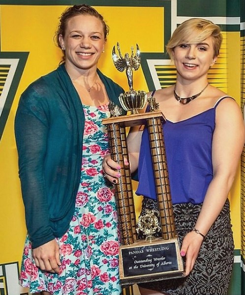 Haley Heffel stepped back into the ring this winter after a 15-month recovery from a knee injury. Heffel holds the University of Alberta wrestling MVP trophy with assistant