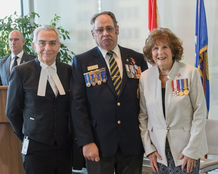 Fawcett resident Roger Smiley (centre) was recognized with the Sovereign&#8217;s Medal For Volunteers, the highest award for volunteers presented in Canada, for almost 24