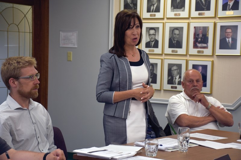 Westgate Developments Ltd.’s Tammy Joel Kemna, backed by business partner Jim Biblow (right) and engineer Rob Wartz, walks town council-lors through the area structure plan