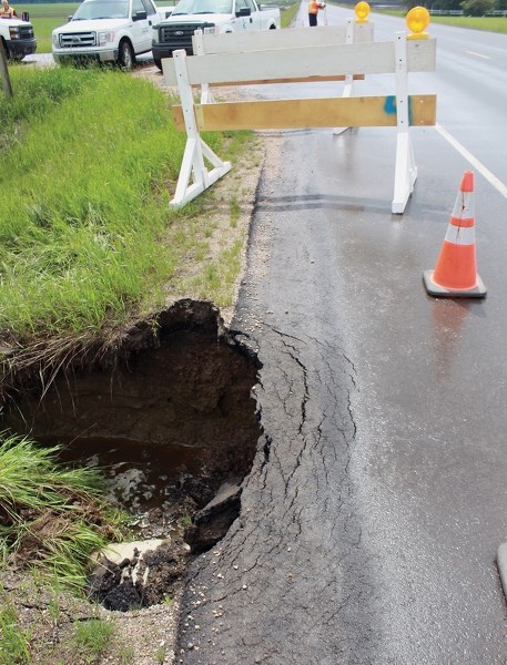Traffic on Highway 44 near Township Road 610 was reduced to one-lane for a good part of the day June 16 after the ground around a culvert gave way following heavy rain.