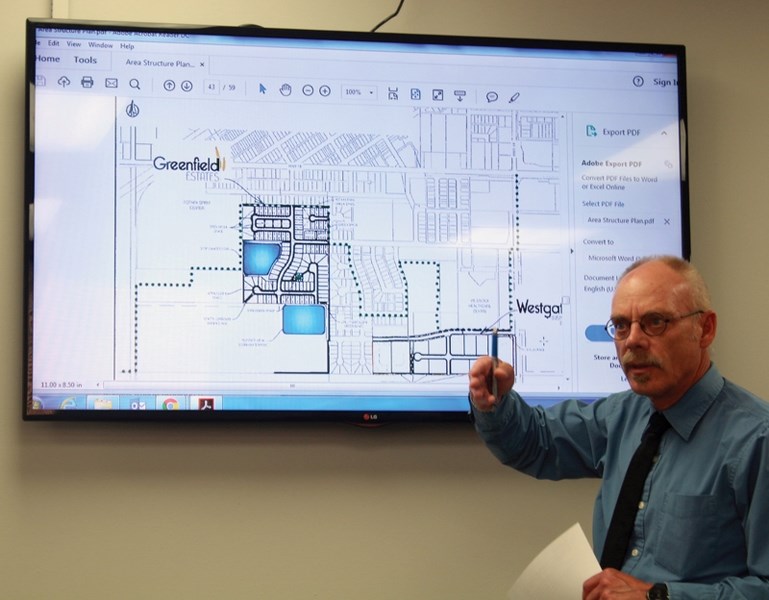 Town of Westlock chief administrative officer Dean Krause speaks during a July 4 public hearing on the Westgate Business Park and Greenfield Estates development.