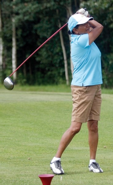 Nisha Buksh tees off on the 10th hole at the Westlock Golf Club during the Westlock Seniors Open July 6. Buksh had a round to remember as she not only claimed the