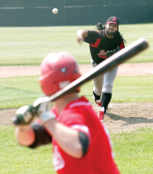 Red Lions player Jordan Brand slides into home plate during a regular season game. The Red Lions played a playoff game against the St. Albert Cardinals at Keller Field Aug.