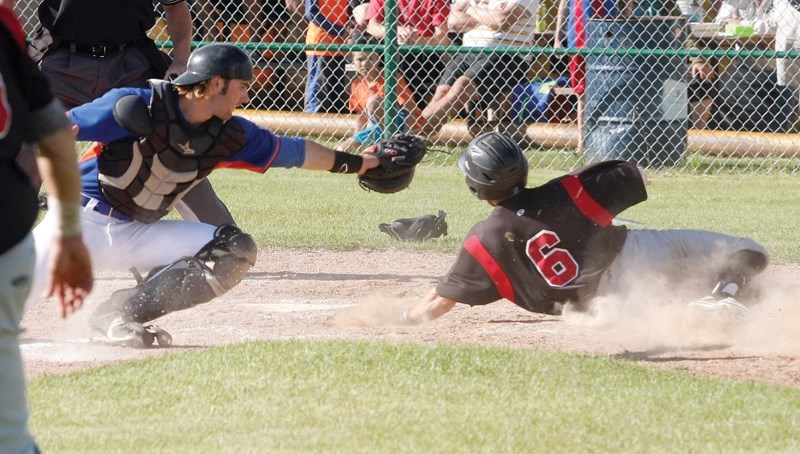Red Lion Austin Watamaniuk slides into home during their 3-0 Game 2 win over the Stony Plain Mets in the NCABL semifinals Aug. 19. After los-ing Game 1, the Red Lions posted