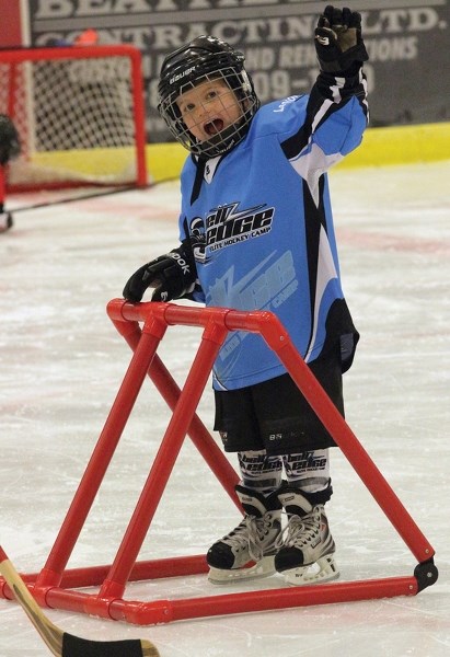 Easton McQuade waves to his mother as he practices skating during the Westlock Minor Hockey Association’s annual &#8220;I Love Hockey &#8221; event Sept. 30 at the Rotary