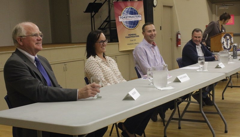 Pembina HIlls Public School Board trustee candidates Ken Mead and Jackie Carson share a laugh with Westlock County council hopefuls Jared Stitsen and Lavern Bazin at an Oct.