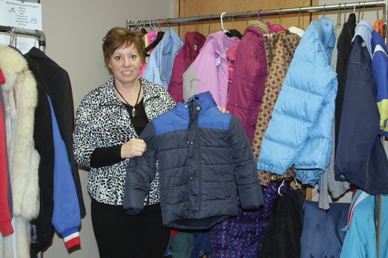 FCSS program assistant Bonnie Breadon shows off some of the clothing currently available as part of the Coats 4 Kids program. FCSS is also accepting donations of clean