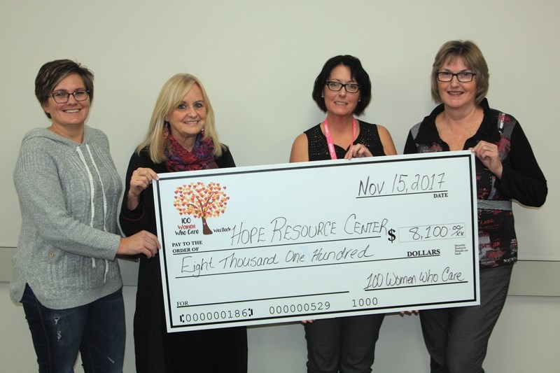 Hope Resource Centre executive director Sylvia Yoder, second from left, is presented an $8,100 donation from Denise Boulerice (far left), Tammy Round and Sue Dougans of 100