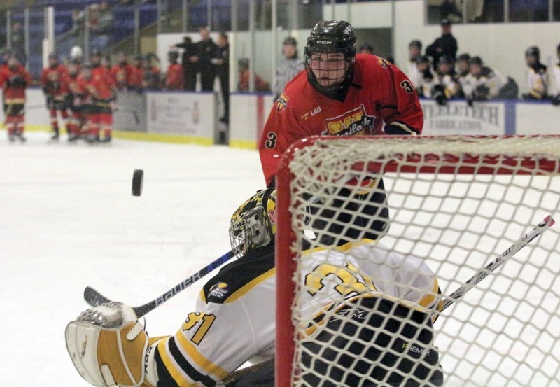 Westlock Warriors Aiden Schmidt fires a bullet at Barrhead Steelers goaltender Ty Steinbring during a shootout at the conclusion of the opening game of the Gord Smith
