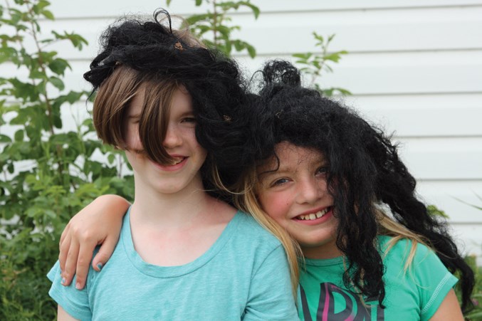  Lucy King (left) and Mara Scott had a blast playing with different wigs.