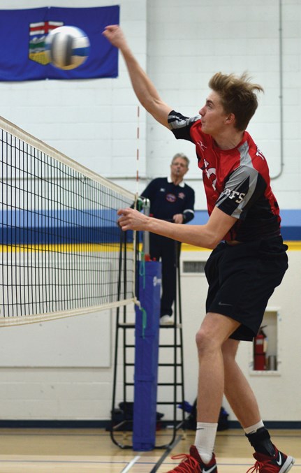  T-Bird Carston Bergeron spikes the ball in a contest versus Whitecourt.