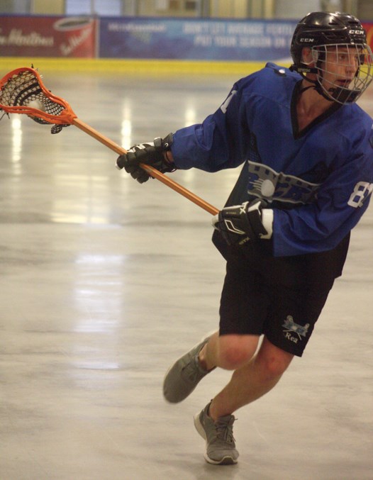  Marcus Rea of the Westlock Junior ‘B’ Rock handles the ball while breaking into the Sherwood Park Titans’ zone during a loss at the Rotary Spirit Centre June 22. The Rock finished off their Rocky Mountain Lacrosse League schedule with a 4-11-0 record.