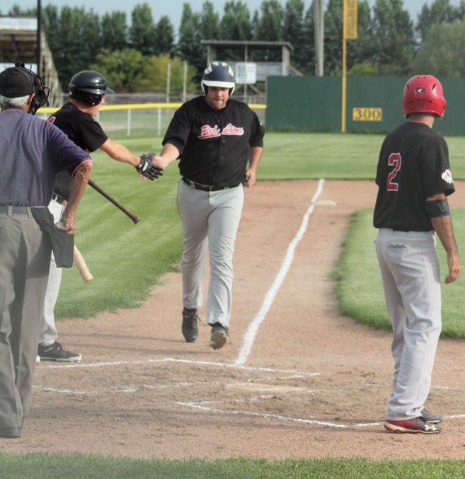  Westlock Grey Lions’ Aaron Cotter finishes his homerun trot around the bases at Keller Field July 23 after hitting another grand slam over the centre field fence, his second in as many weeks. The Grey Lions took an early lead in the first inning, thanks to Cotter’s dinger and went on to embarrass the Sherwood Park Ducks 19-1.
