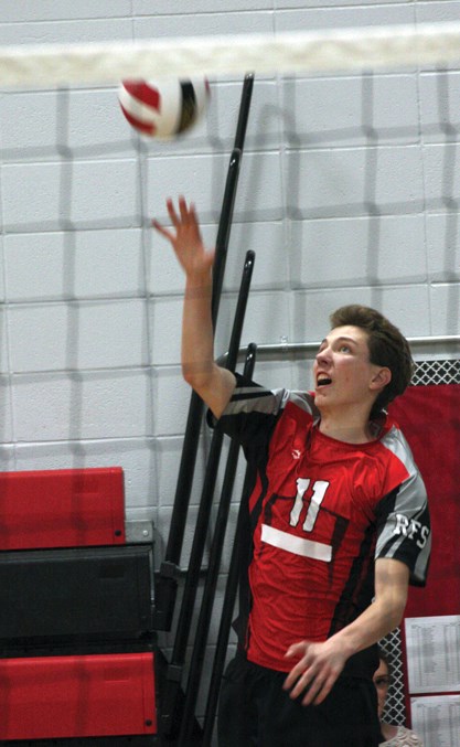  Mack Hay serves up an ace during the boys game against Fort Saskatchewan Sept. 21. The school’s two gyms were filled with 12 teams from around the region, with the T-Birds taking silver on both the girls and the boys side.
