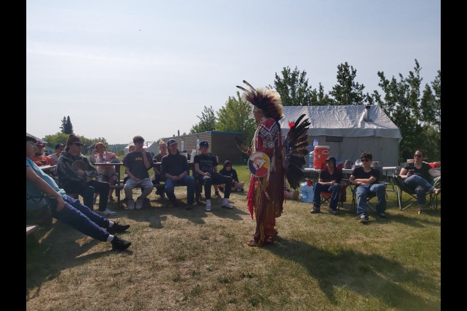 Dennis McDonald from RF Staples Secondary School. He was asked (offered protocol) to drum while Knowledge Holder Jason Bigcharles (of the East Prairie Métis Settlement) donned his powwow regalia to share a traditional story through dance at the Land Based Learning Camp on June 3 to 5. Photo Supplied.