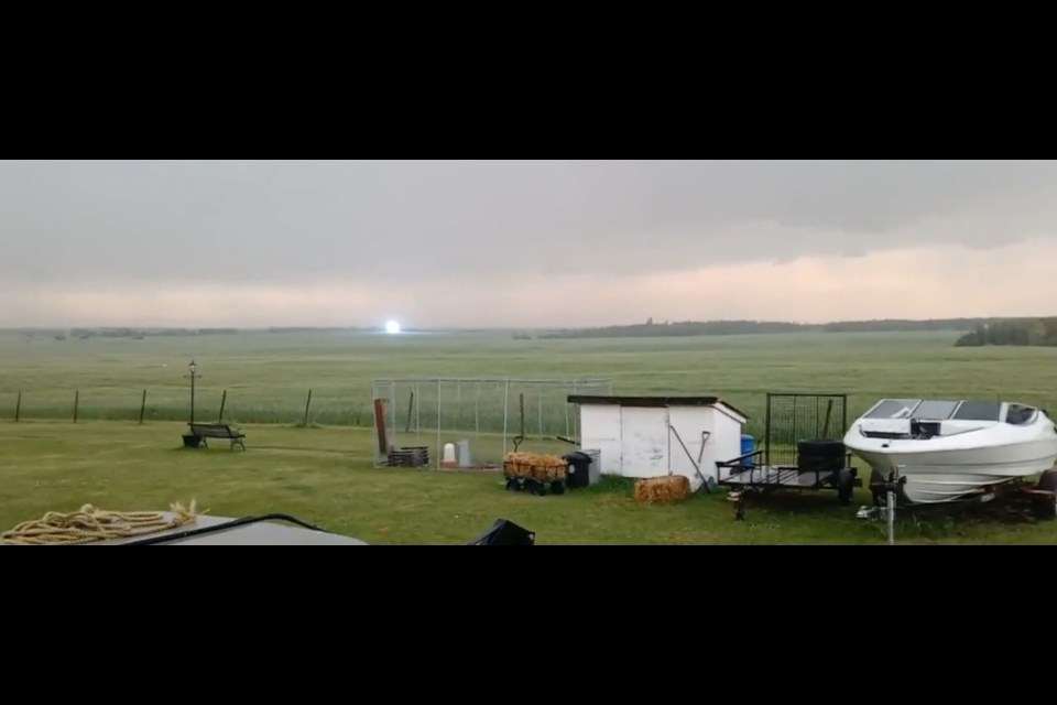After a particularly strong lightning strike, a bluish ball of light materialized, hovering just above the ground. Ed and Melinda Pardy captured this event in Rich Valley on July 2.
