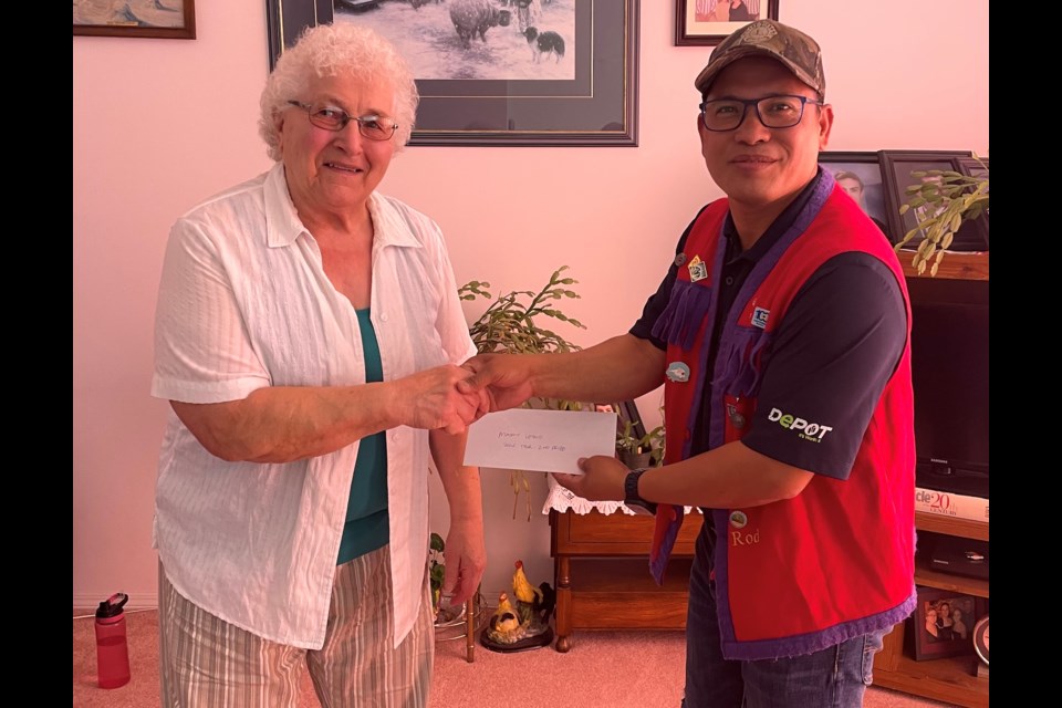 Athabasca's own Mary Lebid took second place and a prize of $750 from this year's Athabasca Lions Club Tennis Ball Race, held on 49 Street following the Canada Day Parade. Pictured are Lebid and Athabasca Lions Club treasurer Rod Cunanan. 