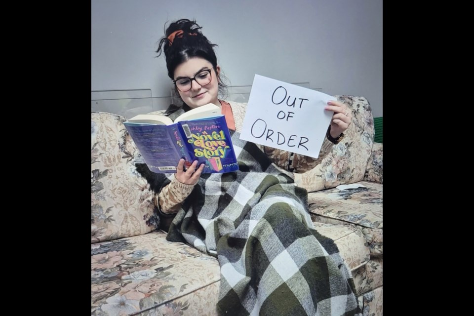 Mackenzie Kitz was striking as the Westlock Library staff prank library visitors with a strike on April 1, April Fools Day. Photo supplied. Sandy Doucet/ Westlock News