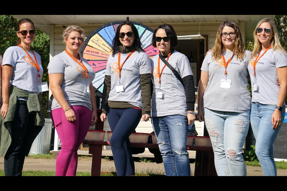 L-R: Volunteers Jen Burgquist, Michelle Cummings, Kelly Saunders, Angelene Mckenzie, Jessica Wallace and Stacey Grunerud pose for a team photo Sept. 7 during the 13th annual Road to Hope golf classic. Photos by Lexi Freehill/AA                             