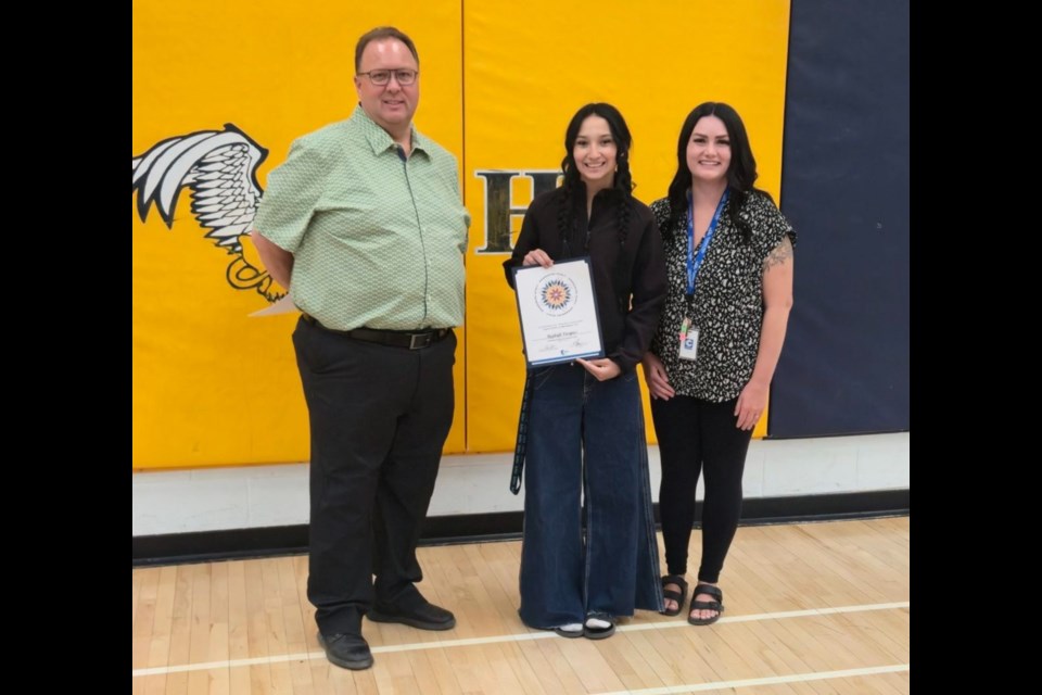 Barrhead Composite High School student Rayleigh Vazquez who received Honourable Mention certificates for the Honouring Spirit: Indigenous Student on June 13. left to right - Pembina Hills School Board Chair David Truckey, Rayleigh Vazquez, and Coach Kara Rinas. Photo supplied.