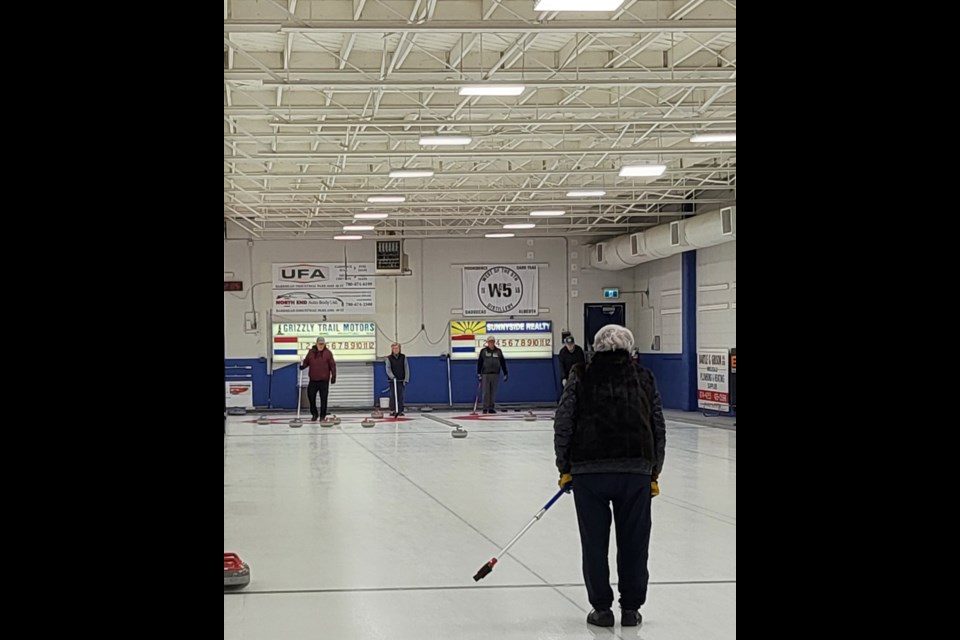 Marcia Moon (Front) with her curling partner Jeanette Shipton curled with Bob Sirack and Tracy MacKenzie-Grieve on Feb. 18 at the Barrhead Curling Rink.