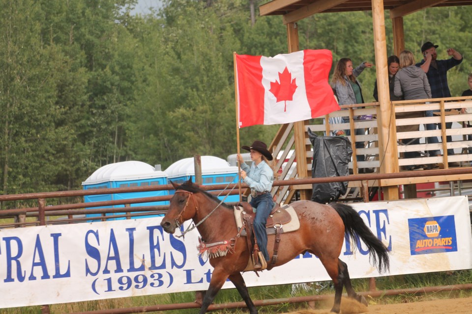 Hell on Hooves returned for the third year in a row, with over 2,000 people dropping by for the roughstock rodeo, barrel racing, and community dance. Sydney Miller got things started, carrying the Canadian flag around the arena as part of the opening ceremonies.