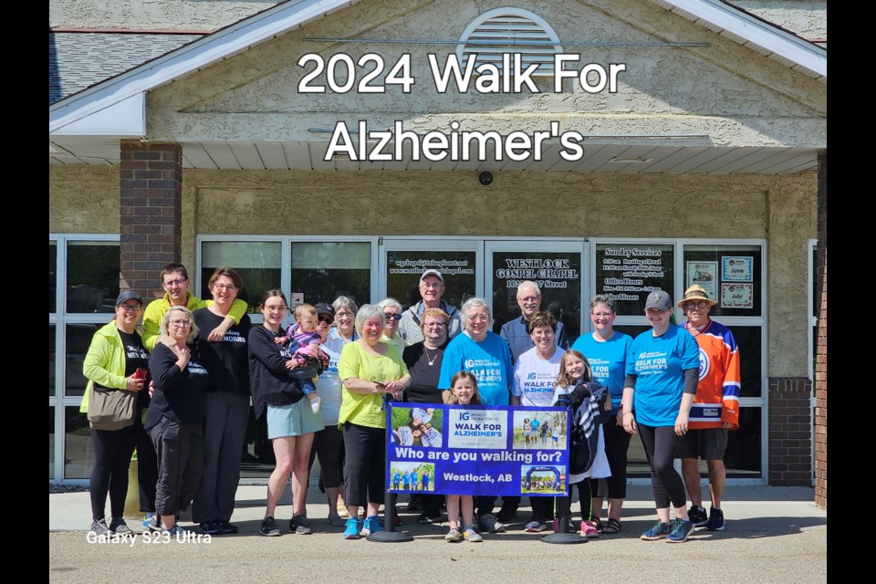 The participants in the Walk for Alzheimer's gather in front of the Westlock Continuing Care Centre.