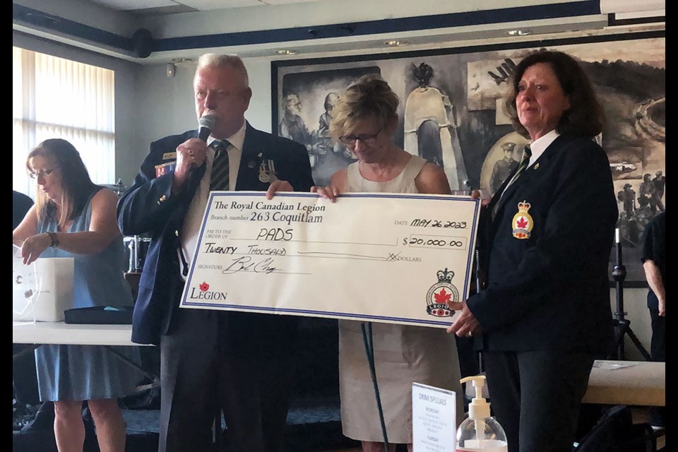 Coquitlam Legion #263 present a $20,000 donation to the Pacific Assistance Dogs Society (PADS) from its 2022 poppy campaign.