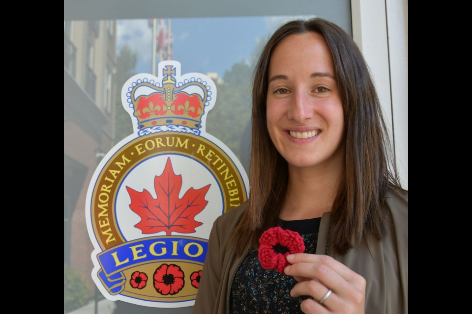 Port Coquitlam resident Alanna Wong holds a poppy she crocheted.