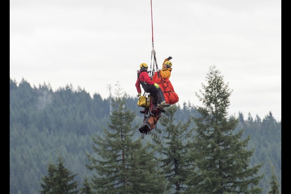 Annette Poitras is lifted to safety in Coquitlam in 2017 after being lost for three days. | Marcel Poitras