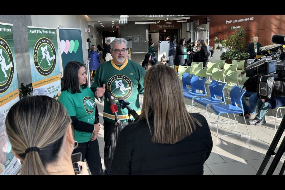 Logan Boulet's parents talk with media prior to the launch of Green Shirt Day, April 7, 2025.