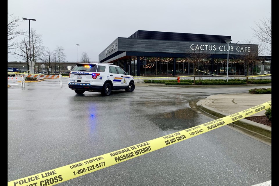 Police were on scene near the Cactus Club restaurant near Coquitlam Centre mall on Monday, Feb. 12, 2024, to investigate a shooting.