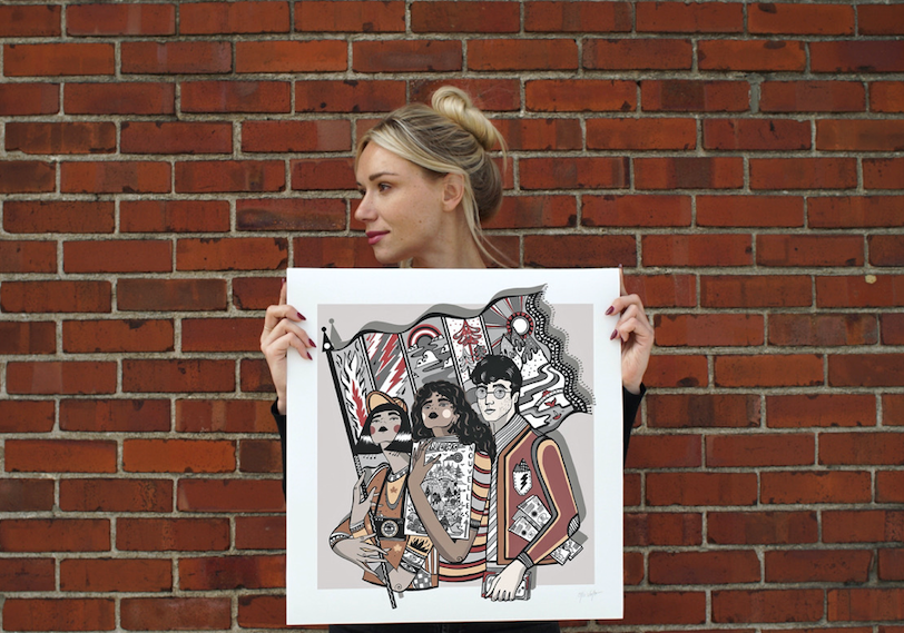 Ola Volo with her Champion The Truth limited edition print for sale during  National Newspaper Week (Oct. 3-9, 2021)